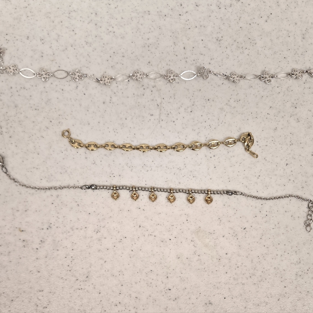 3 Cute Bracelets. 1 Silver, 1 Gold And 1 Is Silver And Gold.